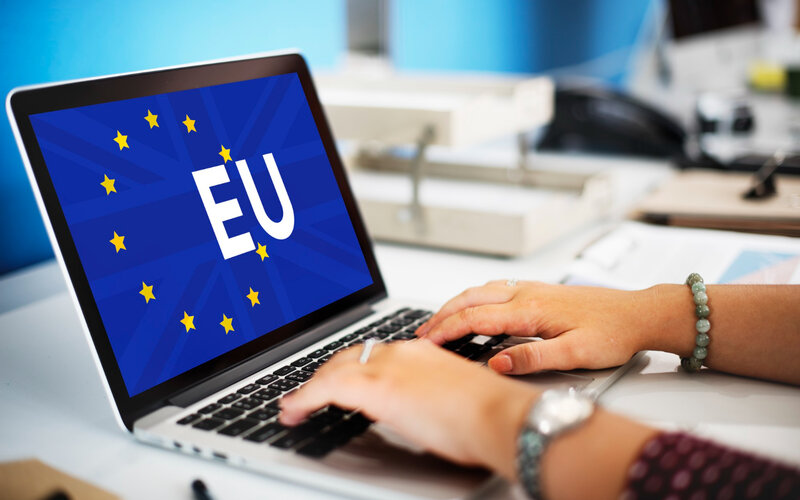 EU flag displayed on laptop screen representing GDPR regulation