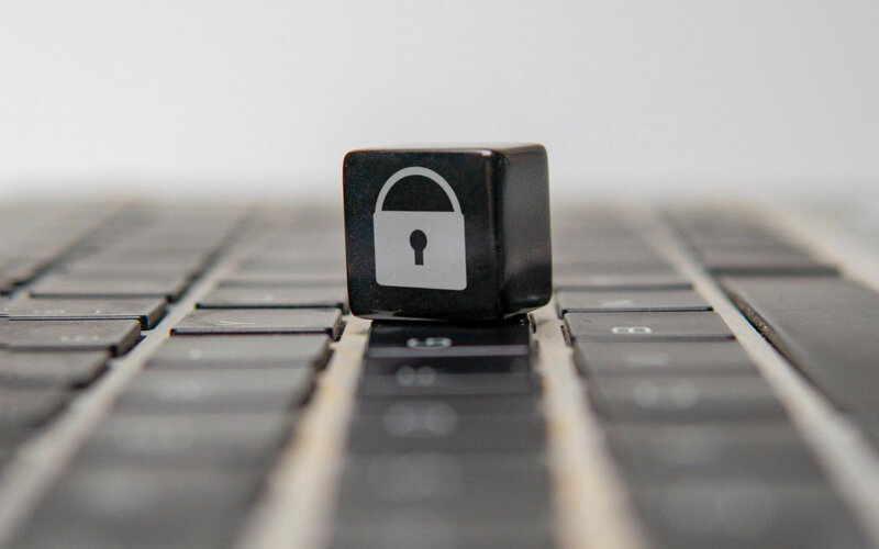 Lock icon on keyboard key representing website security and privacy