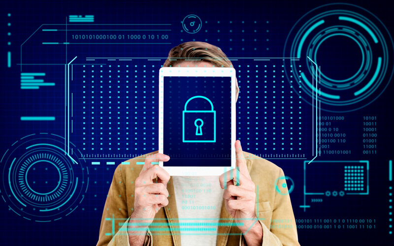 Person holding tablet with lock icon representing data security compliance